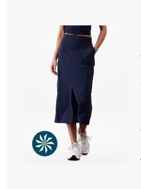 Athleta Navy Midi Skirt with elastic band with Front Slit and side pockets.